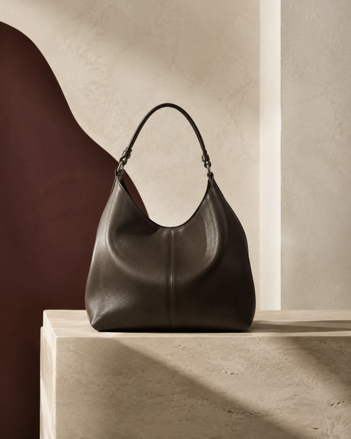 Unbranded sculptural leather handbag in an ivory gallery
