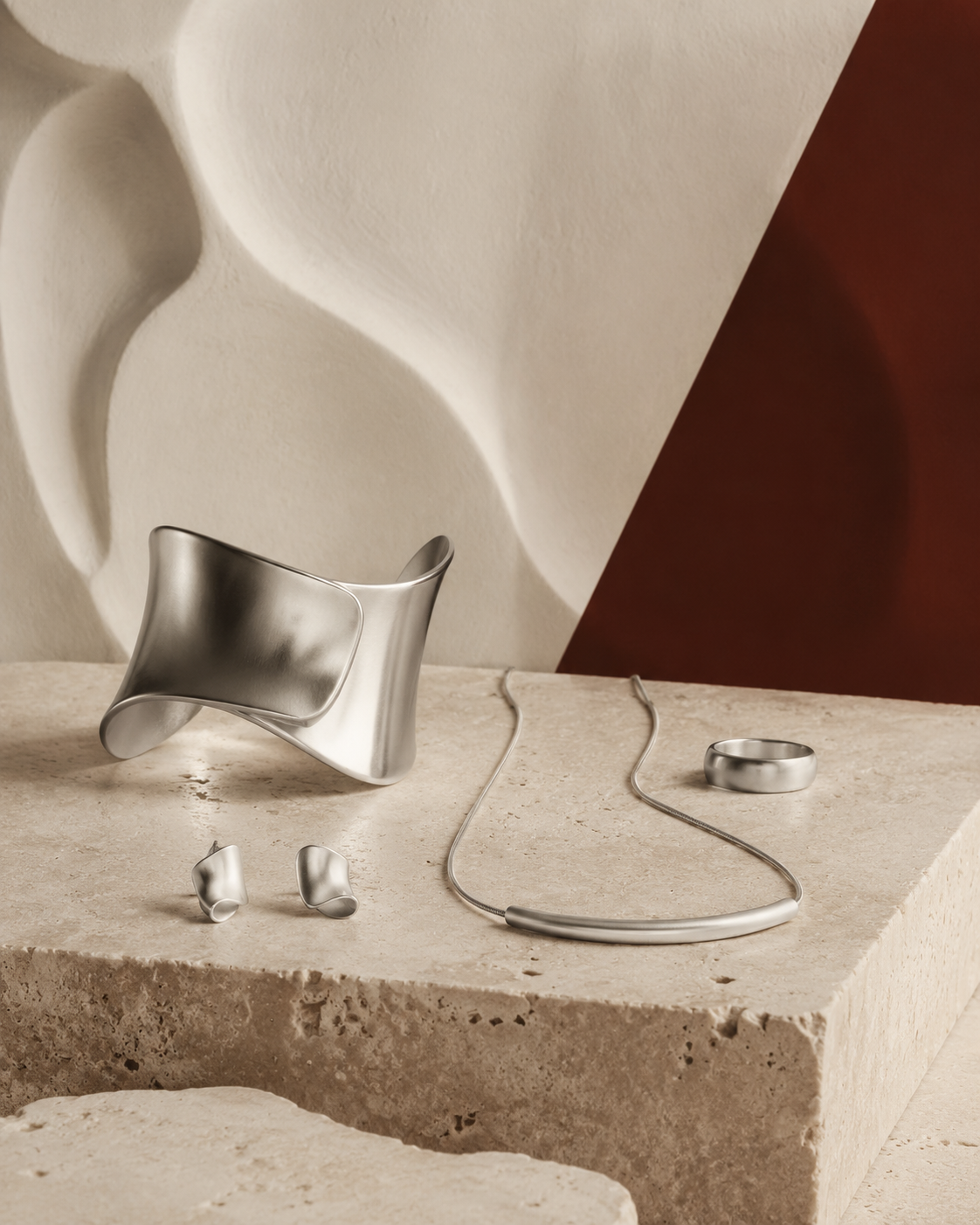Unbranded silver jewelry in a modern ivory gallery